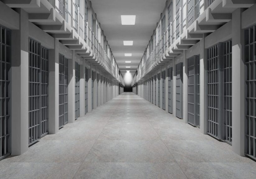 Rows of prison cells, prison interior.